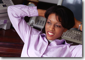 Relaxed woman leaning on her computer